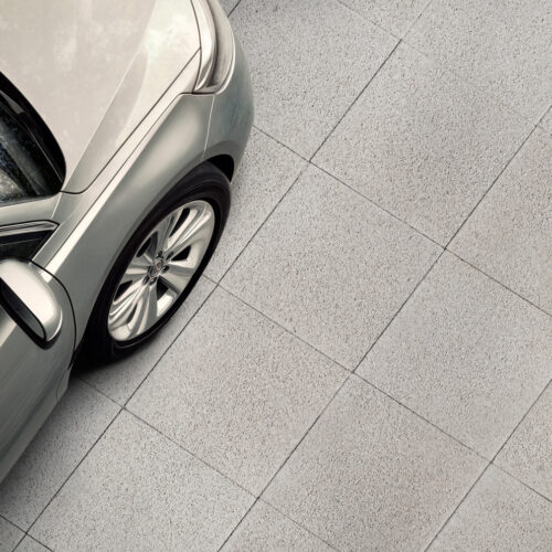 an editorial photo of floor. A partial view of a car showing the tires touching the floor. bird eyes view --ar 6:5 --v 6.1 Job ID: b49d81d0-5b5d-4d98-a008-4792e6124546
